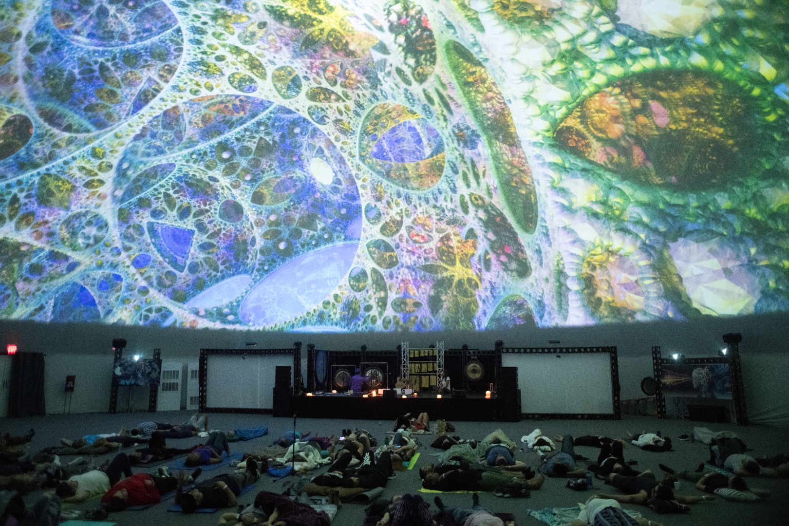 Julia singing and playing guitar during a performance