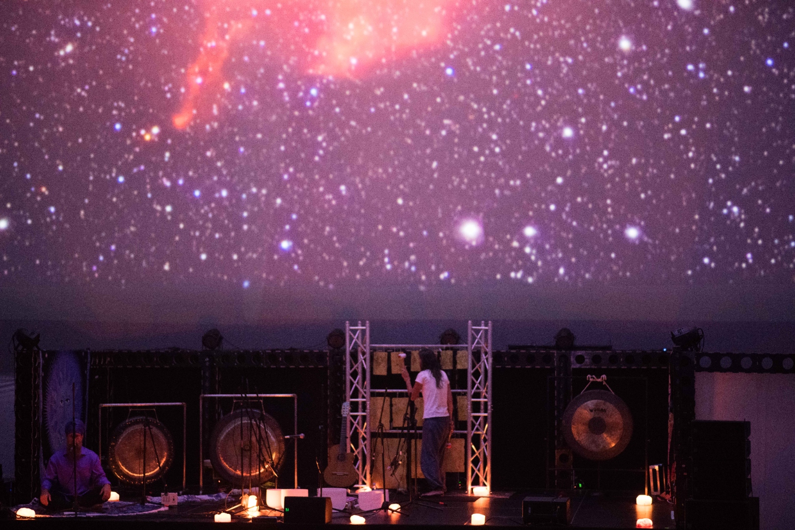 Wisdome LA stage with gongs and cosmic projections